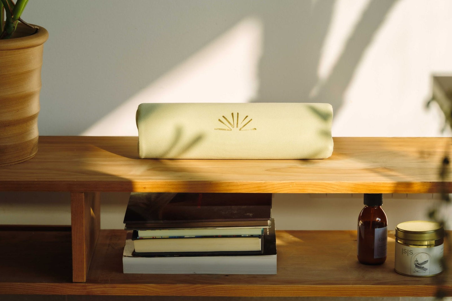 Axis Roll in Sage Green Mist color in home interior, on a wooden surface.